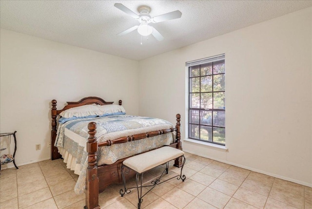1321 Warrington Dr, Austin, TX 78753 - bedroom featuring light tile patterned flooring, a ceiling fan, and a textured ceiling