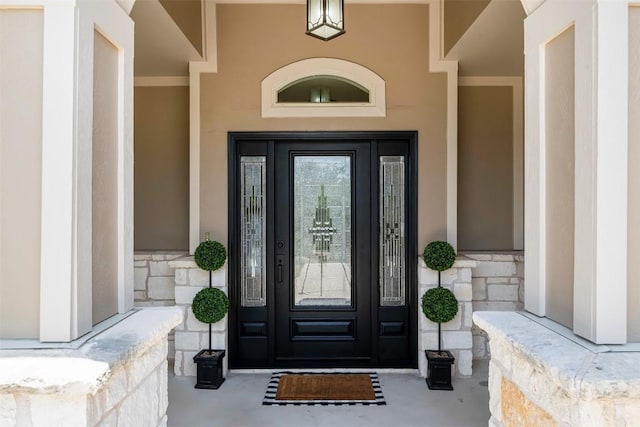 211 E Creek Dr, Dripping Springs, TX 78620 - view of exterior entry with stone siding and stucco siding