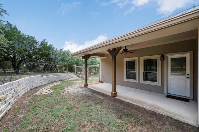 211 E Creek Dr, Dripping Springs, TX 78620 - fenced backyard with ceiling fan and a patio