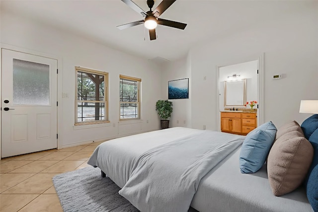 211 E Creek Dr, Dripping Springs, TX 78620 - bedroom with light tile patterned flooring, ensuite bath, lofted ceiling, and a ceiling fan