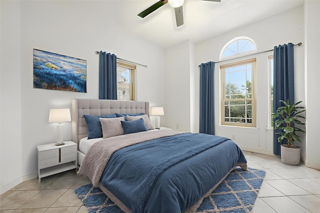 211 E Creek Dr, Dripping Springs, TX 78620 - bedroom with light tile patterned flooring, multiple windows, and ceiling fan