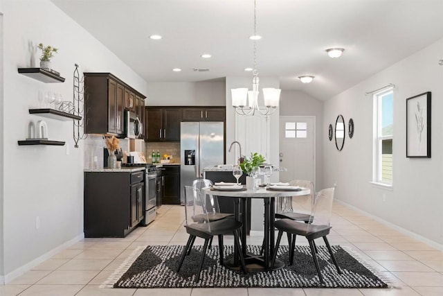 2010 Grow Ln, Austin, TX 78754 - dining room with light tile patterned floors, a chandelier, recessed lighting, and vaulted ceiling