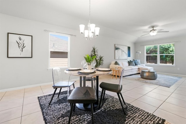 2010 Grow Ln, Austin, TX 78754 - dining area featuring light tile patterned floors, a chandelier, and ceiling fan
