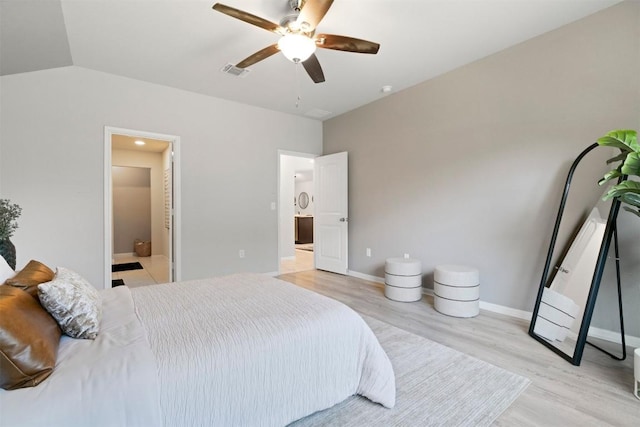 2010 Grow Ln, Austin, TX 78754 - bedroom featuring light wood-type flooring, ensuite bath, and a ceiling fan