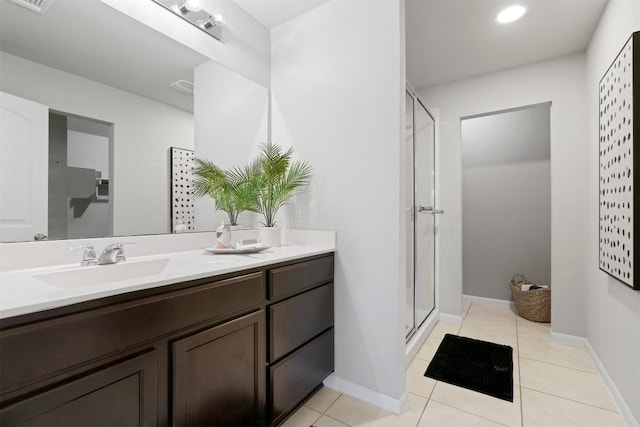 2010 Grow Ln, Austin, TX 78754 - bathroom with a shower stall, double vanity, and tile patterned floors