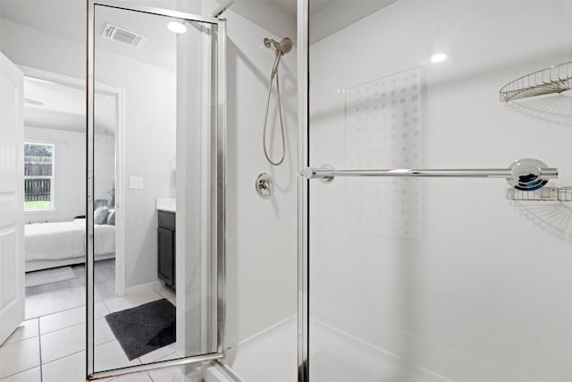 2010 Grow Ln, Austin, TX 78754 - ensuite bathroom with a shower stall and tile patterned floors