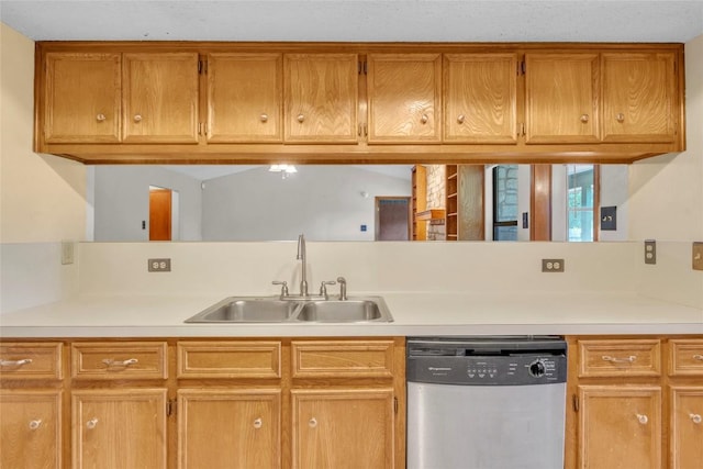 209 Lenz St, Round Rock, TX 78681 - kitchen with dishwasher, light countertops, and brown cabinetry