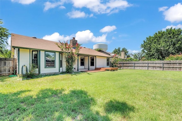 209 Lenz St, Round Rock, TX 78681 - rear view of property featuring a fenced backyard, a chimney, and a patio area