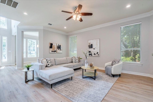 2804 Forest Green Dr, Round Rock, TX 78665 - living room with wood finished floors, healthy amount of natural light, ceiling fan, recessed lighting, and crown molding