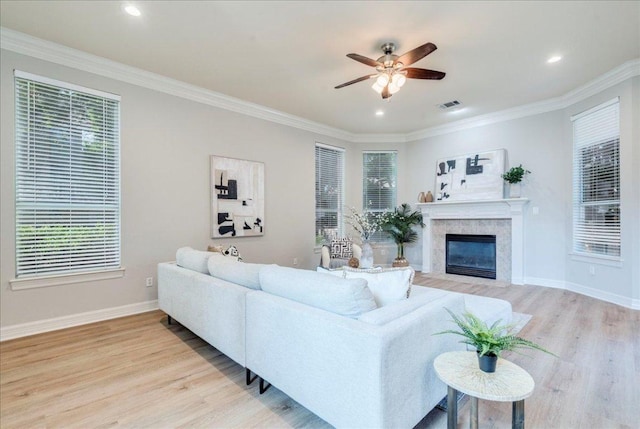 2804 Forest Green Dr, Round Rock, TX 78665 - living area with light wood-type flooring, plenty of natural light, a ceiling fan, ornamental molding, and recessed lighting
