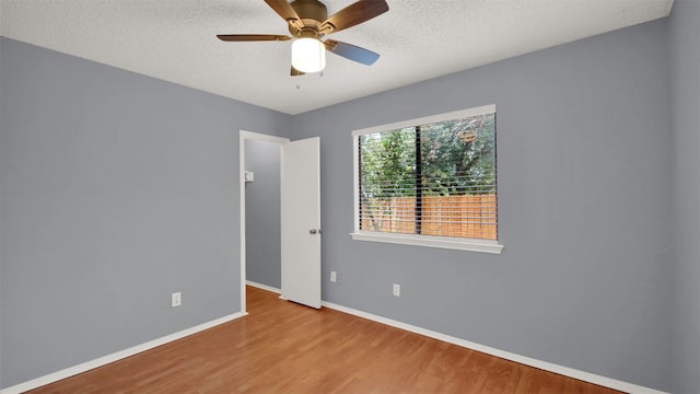 12307 Emery Oaks Rd, Austin, TX 78758 - unfurnished room with wood finished floors, a textured ceiling, and ceiling fan