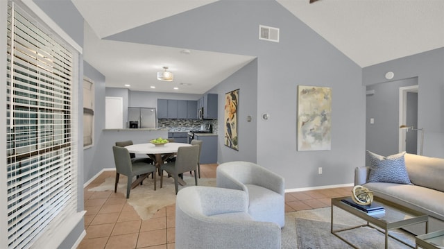 12307 Emery Oaks Rd, Austin, TX 78758 - living room featuring light tile patterned floors, high vaulted ceiling, and recessed lighting