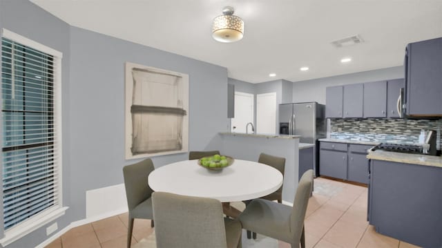 12307 Emery Oaks Rd, Austin, TX 78758 - dining room featuring light tile patterned floors and recessed lighting