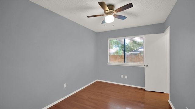 12307 Emery Oaks Rd, Austin, TX 78758 - empty room featuring a textured ceiling, ceiling fan, and wood finished floors