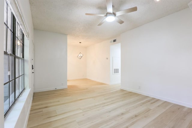 203 E 31st St Unit 206, Austin, TX 78705 - empty room with a textured ceiling, ceiling fan, and light wood-type flooring