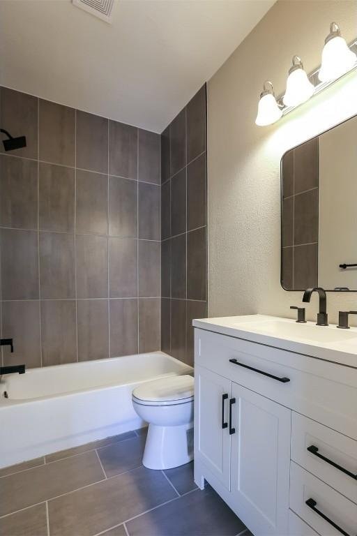 203 E 31st St Unit 206, Austin, TX 78705 - bathroom with vanity, bathtub / shower combination, and tile patterned floors