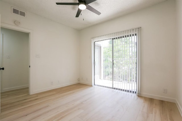 203 E 31st St Unit 206, Austin, TX 78705 - unfurnished room featuring a ceiling fan, light wood-style flooring, a textured ceiling, and a smoke detector