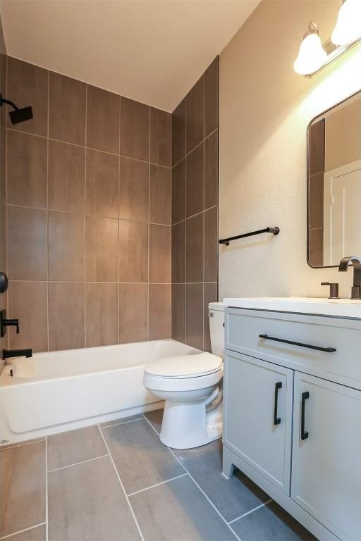 203 E 31st St Unit 206, Austin, TX 78705 - bathroom with vanity, tile patterned flooring, and shower / washtub combination