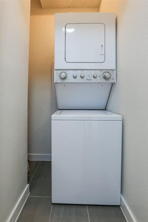 203 E 31st St Unit 206, Austin, TX 78705 - washroom with estacked washer and dryer and tile patterned floors
