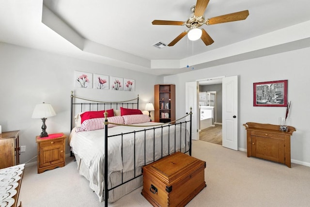 12532 Labrador Cv, Austin, TX 78729 - carpeted bedroom with a raised ceiling and a ceiling fan