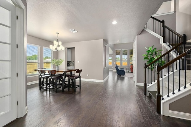 21506 Greylag Dr, Pflugerville, TX 78660 - dining area featuring a chandelier, a textured ceiling, stairs, healthy amount of natural light, and recessed lighting