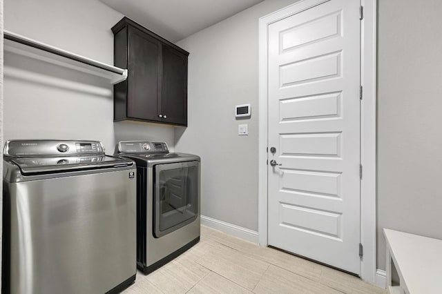 21506 Greylag Dr, Pflugerville, TX 78660 - washroom featuring washing machine and dryer and cabinet space