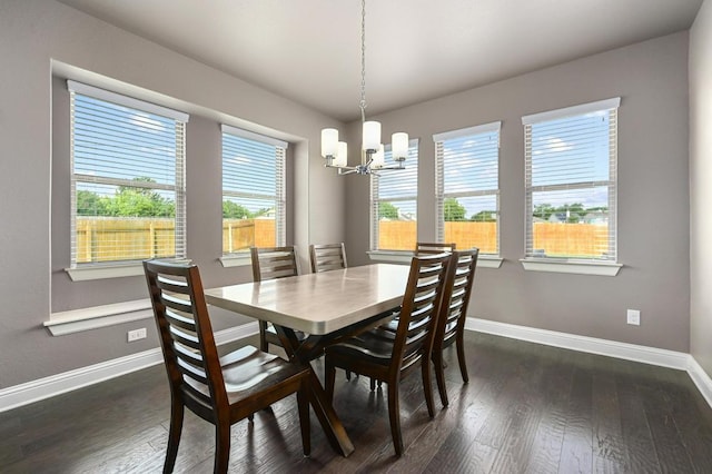21506 Greylag Dr, Pflugerville, TX 78660 - dining area with a chandelier and dark wood finished floors