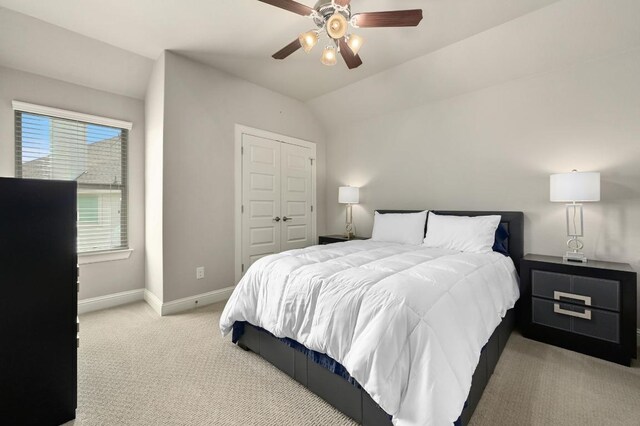 21506 Greylag Dr, Pflugerville, TX 78660 - bedroom featuring light carpet, a closet, a ceiling fan, and vaulted ceiling