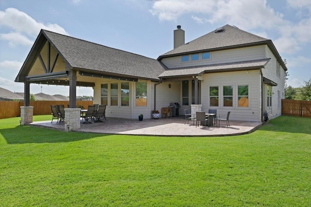 21506 Greylag Dr, Pflugerville, TX 78660 - rear view of house with a chimney, a fenced backyard, a patio, and a shingled roof