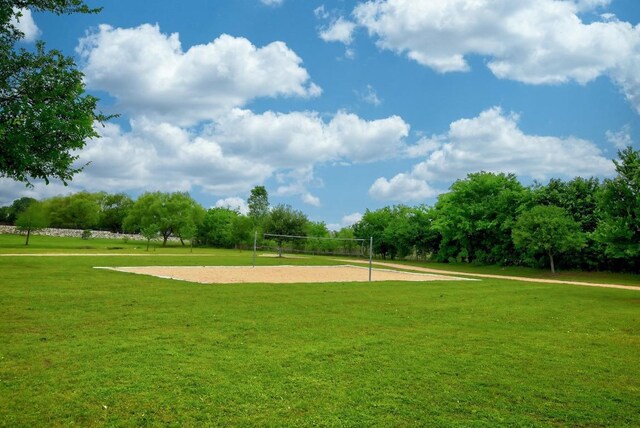 21506 Greylag Dr, Pflugerville, TX 78660 - view of home's community featuring volleyball court and a lawn
