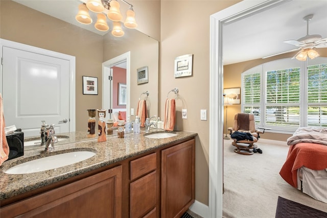 207 Breezeway Ln, Georgetown, TX 78633 - full bath with double vanity, a ceiling fan, and a chandelier