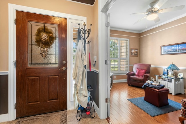 207 Breezeway Ln, Georgetown, TX 78633 - entrance foyer with crown molding, wood finished floors, and a ceiling fan