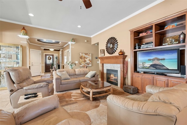 207 Breezeway Ln, Georgetown, TX 78633 - living room with crown molding, a ceiling fan, a fireplace, recessed lighting, and tile patterned flooring