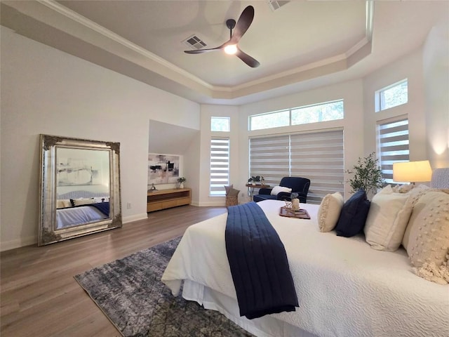 10303 Spicewood Pkwy, Austin, TX 78750 - bedroom with a raised ceiling, wood finished floors, crown molding, and ceiling fan