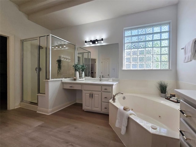 10303 Spicewood Pkwy, Austin, TX 78750 - full bath featuring a tub with jets, a shower stall, vanity, and wood finished floors