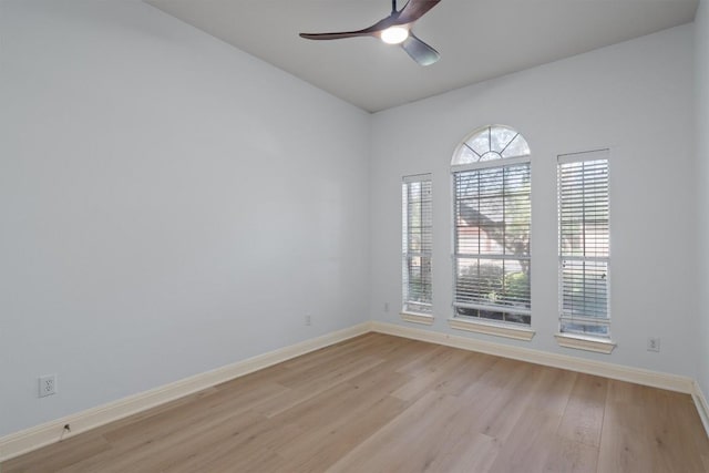 10303 Spicewood Pkwy, Austin, TX 78750 - spare room with light wood finished floors and a ceiling fan