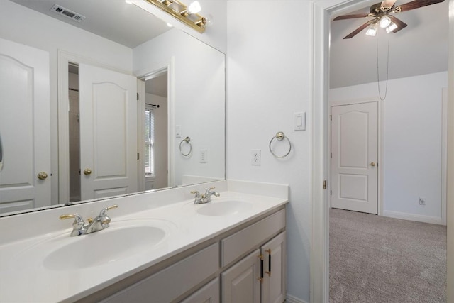 10303 Spicewood Pkwy, Austin, TX 78750 - bathroom featuring double vanity and a ceiling fan
