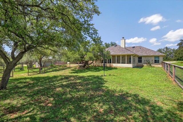 127 W Stonecastle Dr, Granite Shoals, TX 78654 - fenced backyard with a sunroom