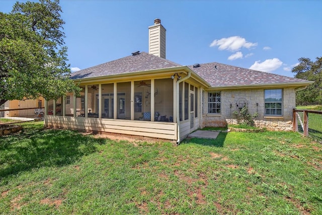 127 W Stonecastle Dr, Granite Shoals, TX 78654 - rear view of house with a chimney, a sunroom, a fenced backyard, a ceiling fan, and a shingled roof