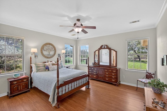 127 W Stonecastle Dr, Granite Shoals, TX 78654 - bedroom with light wood-type flooring, crown molding, and ceiling fan