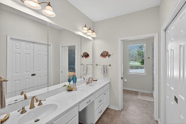 127 W Stonecastle Dr, Granite Shoals, TX 78654 - bathroom with double vanity and baseboards