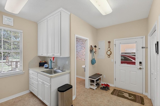 127 W Stonecastle Dr, Granite Shoals, TX 78654 - kitchen with light countertops, white cabinets, and light carpet