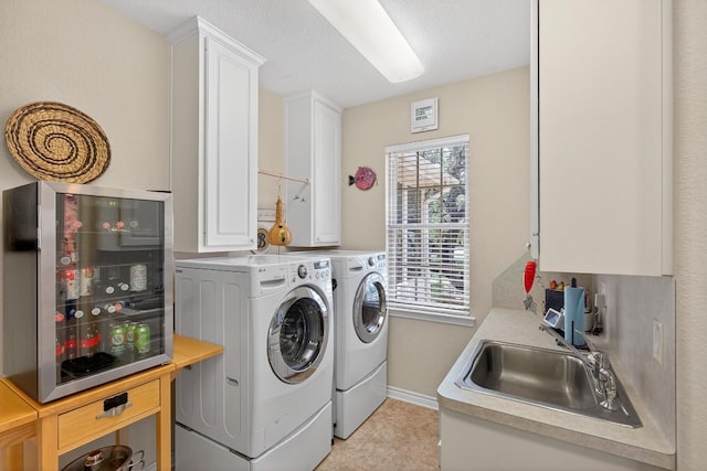 127 W Stonecastle Dr, Granite Shoals, TX 78654 - washroom featuring washer and clothes dryer and cabinet space