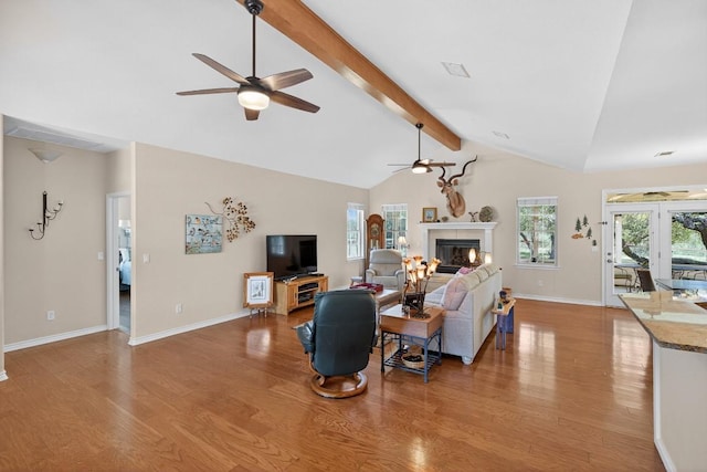 127 W Stonecastle Dr, Granite Shoals, TX 78654 - living room with a ceiling fan, light wood-style flooring, and a tile fireplace