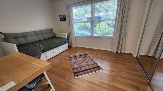 7122 Wood Hollow Dr Unit 41, Austin, TX 78731 - living room featuring wood finished floors and baseboards