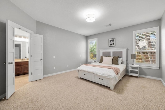 10820 Sky Rock Dr, Austin, TX 78739 - bedroom with light colored carpet and ensuite bath