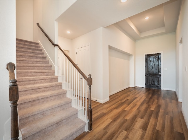 2320 Lucky Ln, Leander, TX 78641 - foyer entrance featuring stairs, wood finished floors, recessed lighting, and a tray ceiling