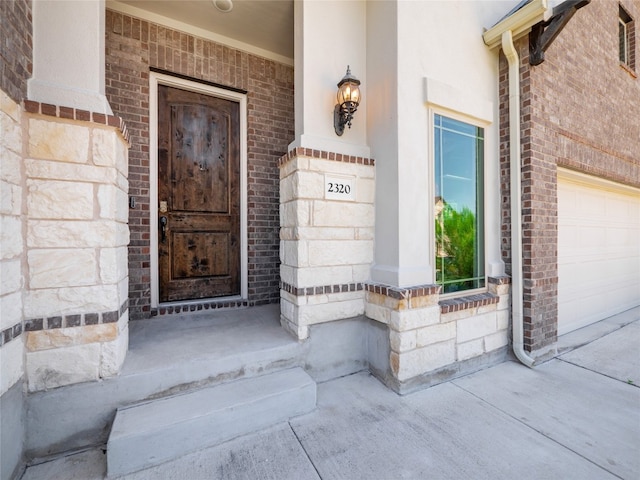 2320 Lucky Ln, Leander, TX 78641 - entrance to property featuring brick siding, a garage, and a porch