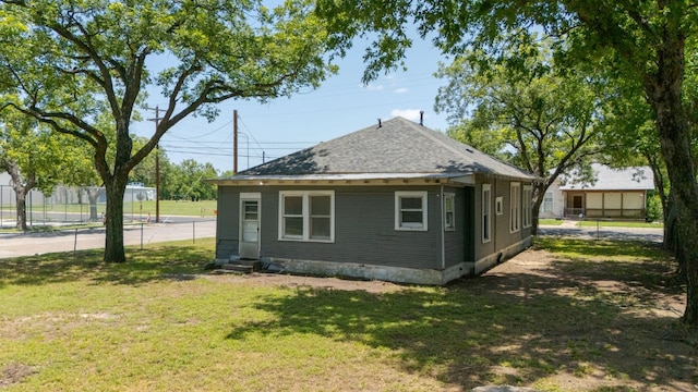 102 S Western Ave, Lampasas, TX 76550 - rear view of property featuring entry steps and roof with shingles