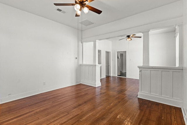 102 S Western Ave, Lampasas, TX 76550 - unfurnished room with ceiling fan, wood-type flooring, and decorative columns